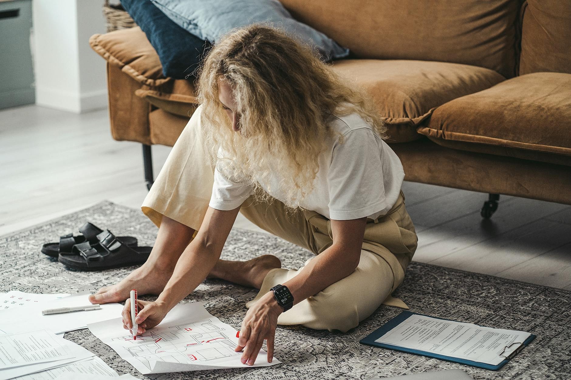 Woman planning self-care routine in a serene home office